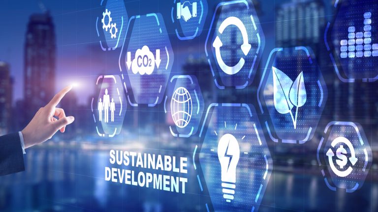 Finger pointing on different symbols for sustainability like leaves, circles etc with the words written on the image "sustainable development"